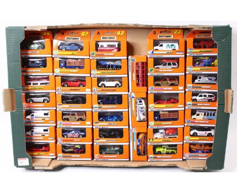 One tray containing a quantity of Matchbox late issue Mattel 1990 diecast vehicles to include Pop-up Camper, Concept 1 Beetle