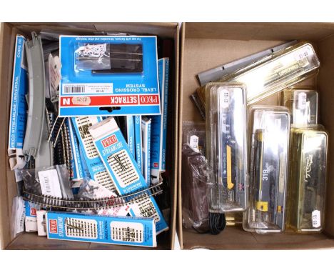 A quantity of N gauge track by Peco and Bachmann, with some boxed N gauge points, and a level crossing, mostly believed to be