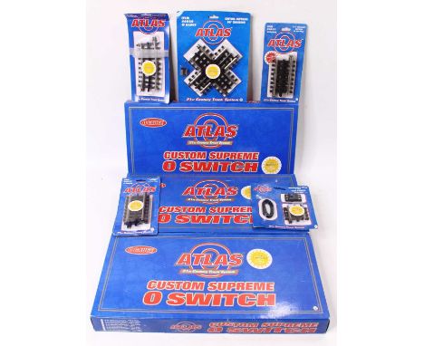 Atlas 0-gauge track, electric, centre rail power collection. Three 'switches' (points) - one each item 6072 0-72 l/h; item 60