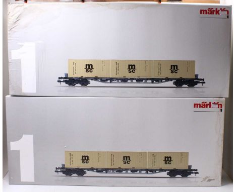 Two Marklin Gauge 1 container wagons, item no. 58708, in original boxes, with three 20ft MSC containers in each box. Wagons a