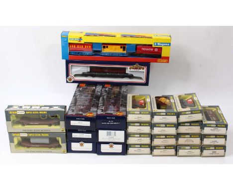 Approx 36 x 00 gauge wagons by Bachmann, Wrenn, and Hornby, including five triple packs, three bogie wagons, and others. All 
