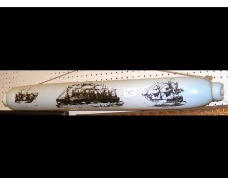 An old 78cm long glass rolling pin decorated with ships 