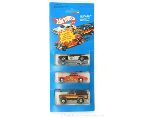 Hot Wheels (Mattel) 3-piece set containing Fire Chaser - red with "Fire Chief" yellow and black side print; Sheriff Patrol - 