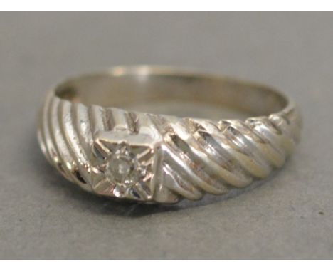 A 15ct. White Gold Solitaire Diamond Ring of Spiral Form