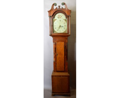 A George III Oak and Mahogany Long Case Clock, the arched hood with swan neck pediment and with turned pilasters above a shap