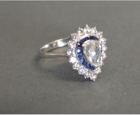 An 18ct White Gold Rose Cut Pear Shaped Diamond and Calibre Cut Sapphire Diamond Cluster Ring