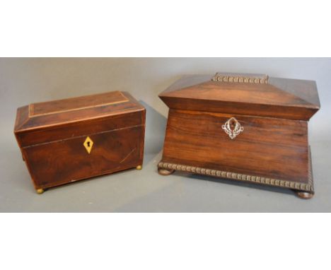 A 19th Century Rosewood Mother of Pearl Inlaid Sarcophagus Shaped Tea Caddy, the hinged cover enclosing a two division interi