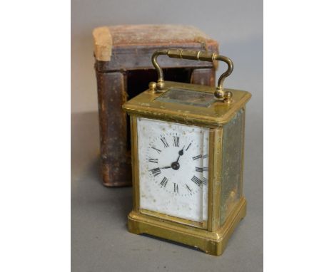 A French Brass Cased Carriage Clock with lever escapement, together with leather outer travelling case