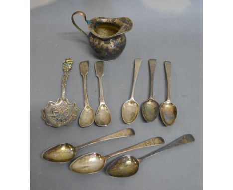 A Small Silver Jug, together with a collection of eight silver spoons and a Sterling silver sifter spoon