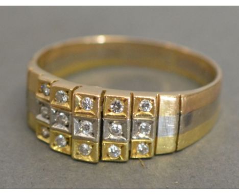 A 15ct. Tri-Colour Gold Diamond Ring set with three rows of diamonds