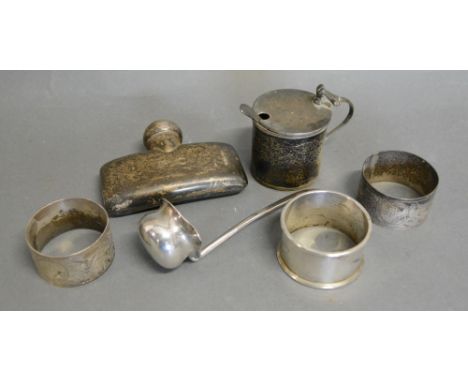 A Small London Silver Flask together with a Chester silver mustard, three silver napkin rings and a small silver ladle
