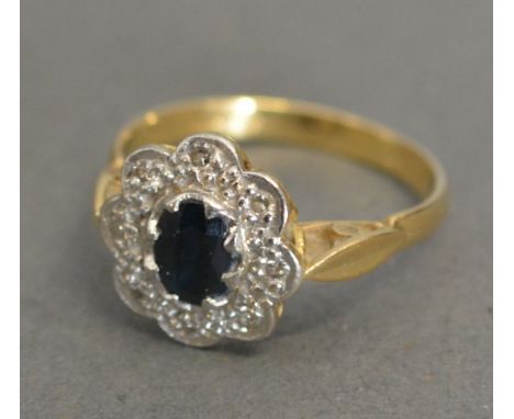 An 18ct. Yellow Gold Sapphire and Diamond Cluster Ring