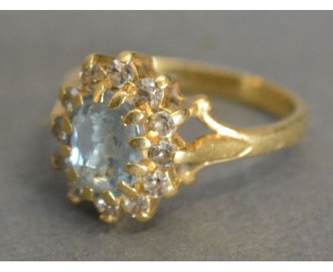 A 15ct. Gold Diamond and Aquamarine Cluster Ring