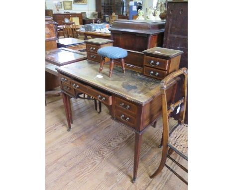 An Edwardian satinwood crossbanded mahogany lady's writing table,  the raised back with four trinket drawers over a leather i