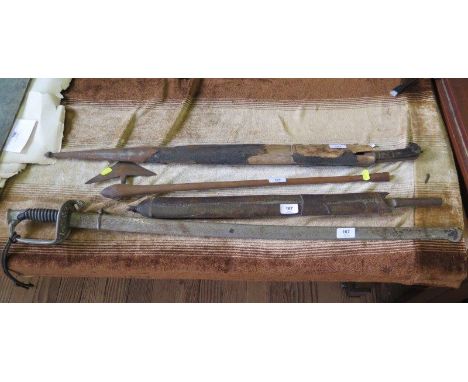 A ceremonial sword, unmarked, with metal scabbard, length of blade 80 cm, a tribal axe with triangular blade on a hardwood ha