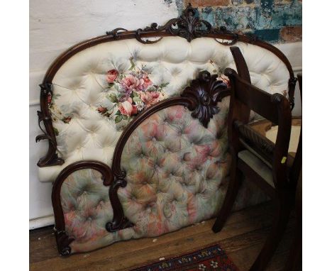 A Victorian mahogany bed head, the arched frame with foliate spray centre and button back upholstery,  154 cm wide and anothe