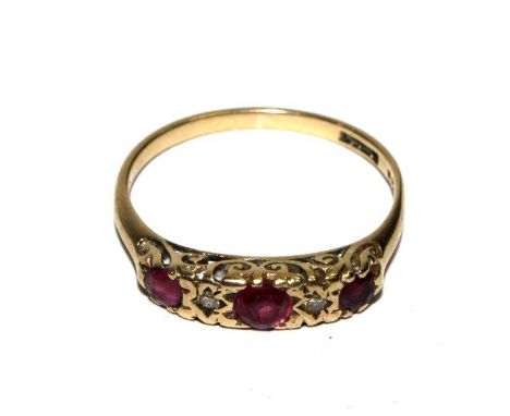 A 9 carat gold set ruby and diamond five stone ring 