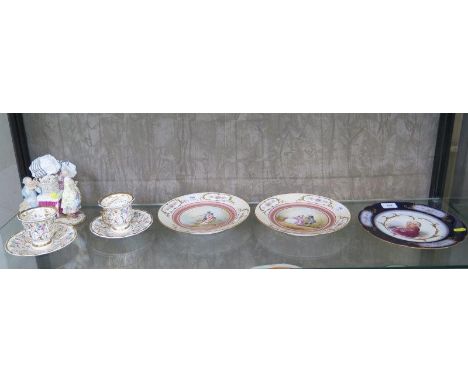 A pair of Sevres 'Chateau des Tuileries' plates painted with scenes of courting couples, signed Sieferd, 24 cm diameter, anot
