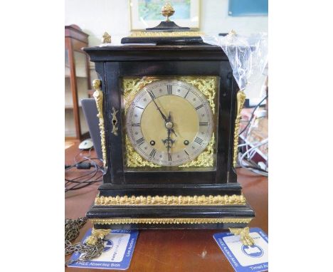 A George II style ebonised and gilt-metal bracket clock, the matted brass dial with scroll spandrels and silvered chapter rin