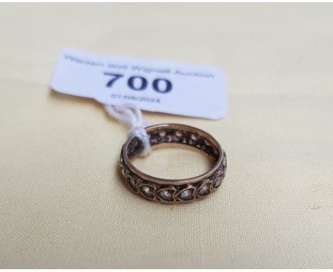 A colourless stone eternity band, marked '9ct', gross weight 2.6g, size K.  