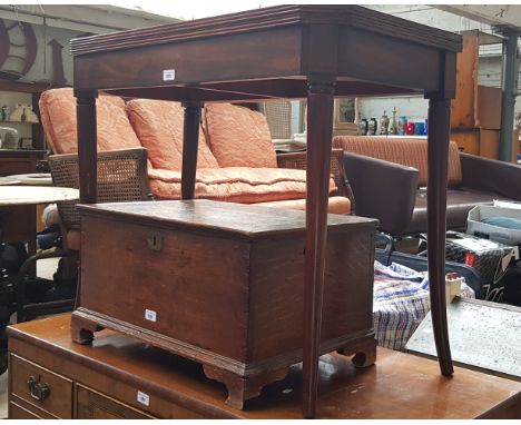A Regency mahogany card table, crossbanded with rosewood to the top, standing on splayed legs.  