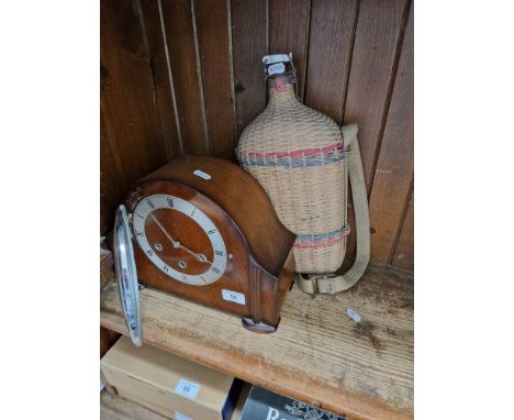 A mixed lot comprising a wicker clad water bottle with Lourdes stopper and a Westminster chime mantle clock.  