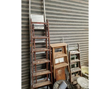A selection of stepladders, wooden and aluminium, including 3 sets wooden, a loft ladder, and a wooden ironing board  