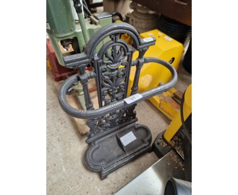 A metal umbrella/stick stand  