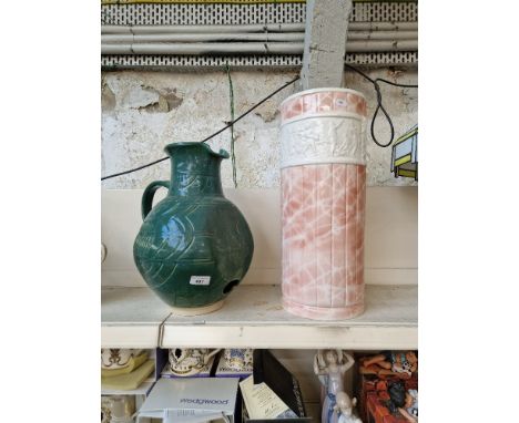A ceramic stick stand with classical style frieze, together with a large ceramic jug with inner shelf and hole towards base -