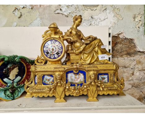 An French late 19th century figural gilt mantel clock with Sevres porcelain plaquesCondition:- General wear through age and u