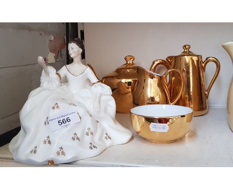 A Royal Worcester gilt lustre teapot, creamer jug, water jug and sugar bowl, togethwer with a Royal Doulton figurine  My Love