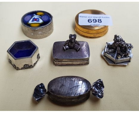 A collection of trinket boxes including hallmarked silver stamp box with articulated teddy bear.  