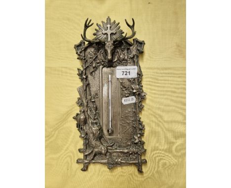 A continental patinated bronze hunting scene desk thermometer.  