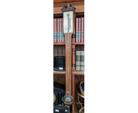 A reproduction stick barometer.  