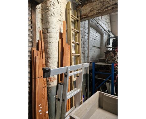 A wooden extending ladder and an aluminium 3 way step ladder  