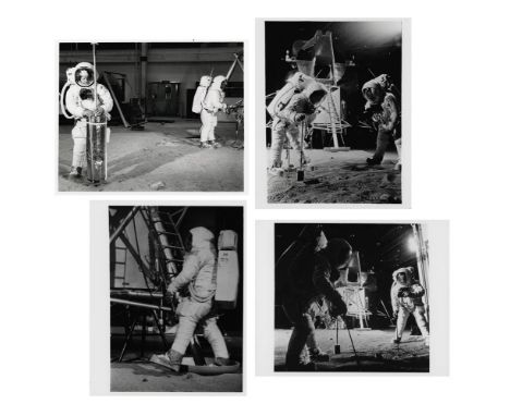 Four views showing the Apollo 11 astronauts in spacesuits performing the first lunar surface training for their upcoming miss