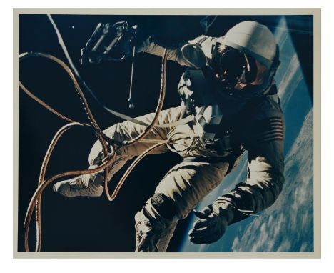 James McDivittEd White performing the first American spacewalk with the brilliant blue of the Earth in the background, Gemini