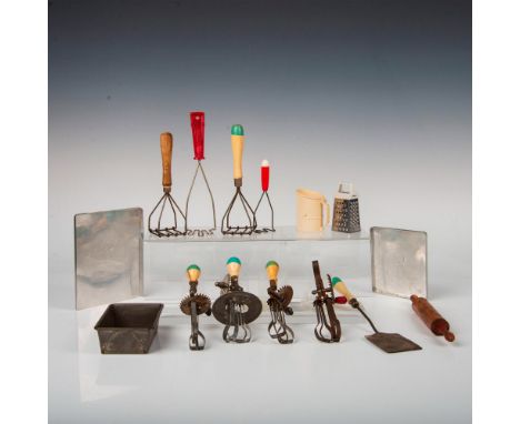 Great grouping of culinary toys including mashers, eggbeaters, rolling pin, cookie sheets, rolled steel loaf pan, grater, sif