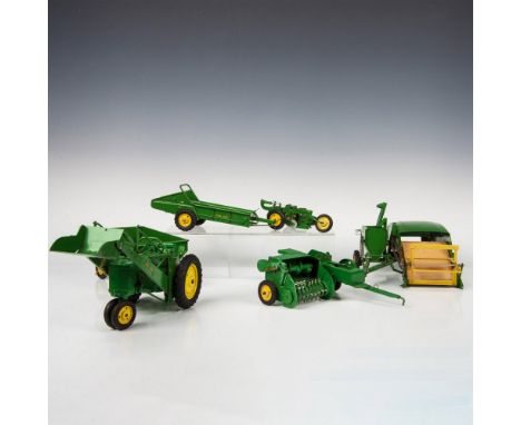 A meticulously crafted all-metal tractor and accessories with functional levers and pulleys, showcasing exceptional attention
