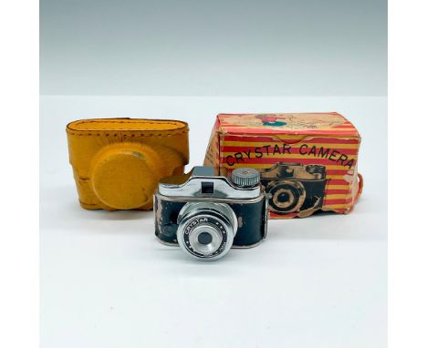 Crystar miniature camera with yellow case. This item has its original box 3"L x 1.25"W x 2"H. Made in Japan. Includes yellow 