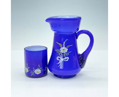 Beautiful hand-crafted pitcher in cobalt blue glass with milk white interior. Hand painted with glittery white flowers to the