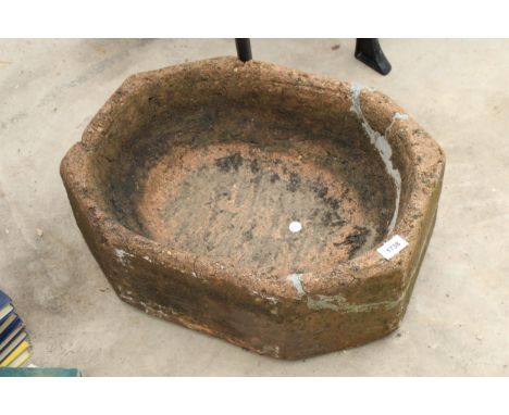 A RECONSTITUTED STONE OCTAGONAL TROUGH PLANTER 