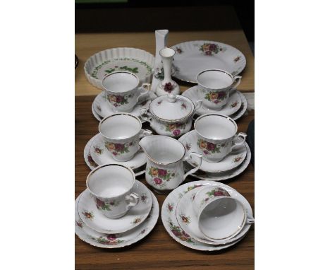 A POLISH TEASET TO INCLUDE A CAKE PLATE, SUGAR BOWL, CREAM JUG, CUPS, SAUCERS AND SIDE PLATES, PLUS A FLAN DISH AND TWO SMALL