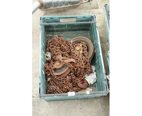 A LARGE VINTAGE PULLEY AND CHAIN 