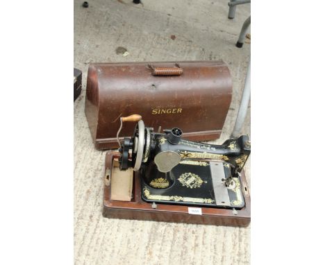 A VINTAGE SINGER SEWING MACHINE WITH WOODEN CARRY CASE 