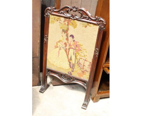 A VICTORIAN ROSEWOOD WOOLWORK FIRESCREEN 