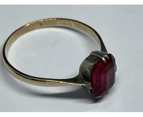 A TESTED TO 9 CARAT GOLD RING (NO WARRANTY GIVEN) WITH A SOLITAIRE POSSIBLY RUBY SIZE T/U GROSS WEIGHT2.02 GRAMS 