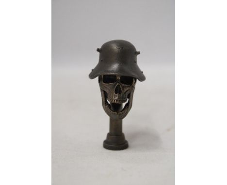A BRONZE SKULL WITH HELMET 