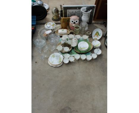 A LARGE ASSORTMENT OF CERAMICS AND GLASS WARE TO INCLUDE CUPS AND SAUCERS, VASES AND DISHES ETC 