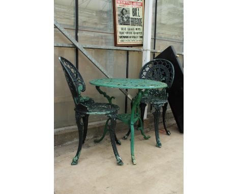 A VINTAGE CAST ALLOY BISTRO SET COMPRISING OF A ROUND TABLE AND TWO CHAIRS 
